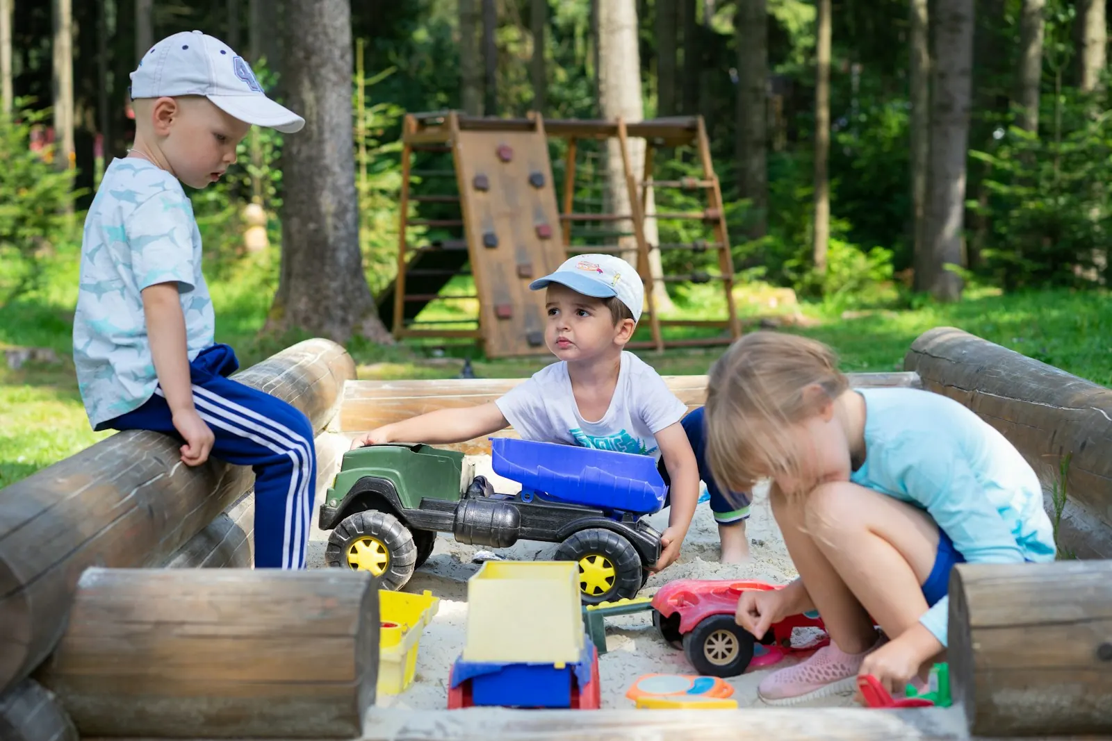 Educator and children engaged in conversation together.